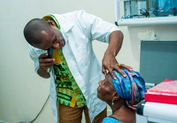 A healthcare professional conducting an eye examination for a patient. Photo: Government of Jamaica.