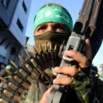 A member of the Qassam Brigades, the armed wing of Hamas, participates in a military parade in Rafah, southern Gaza Strip, August 2016. Photo: Abed Rahim Khatib/APA images.