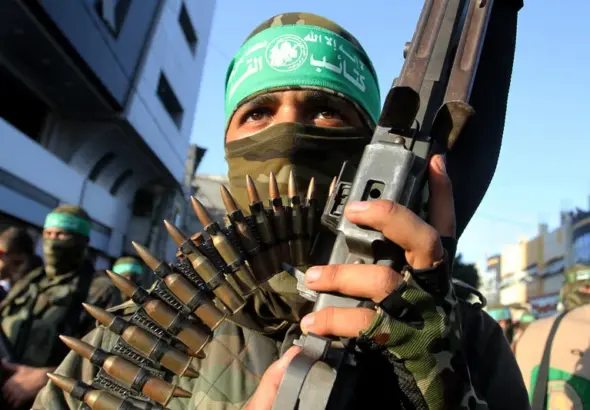 A member of the Qassam Brigades, the armed wing of Hamas, participates in a military parade in Rafah, southern Gaza Strip, August 2016. Photo: Abed Rahim Khatib/APA images.