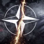 A symbolic representation of the North Atlantic Treaty Organization (NATO), positioned between the United States and European Union flags, with a prominent split down the center. Photo: The Cradle.