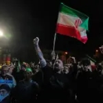 Iranians celebrate the announcement of a two-week ceasefire with the US, at the Inquilab-e-Islami Square in Tehran, in the early hours of April 8, 2026. Photo: AP.