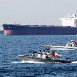 Iranian speedboats patrol the Persian Gulf while tankers pass by. File photo.