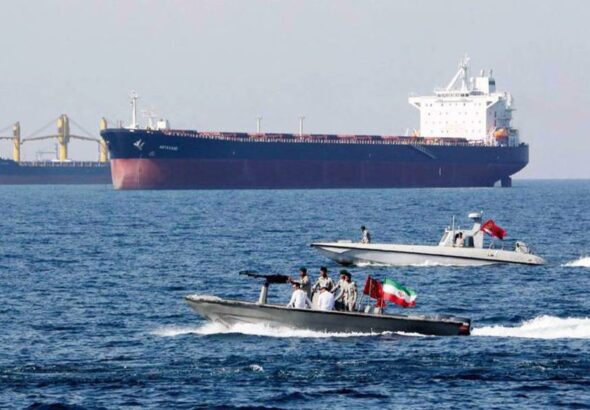 Iranian speedboats patrol the Persian Gulf while tankers pass by. File photo.