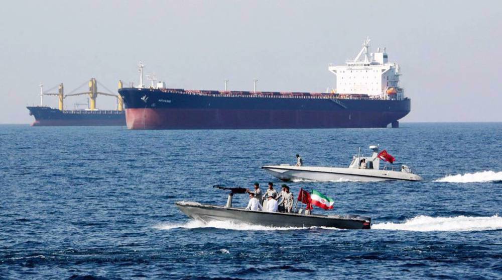 Iranian speedboats patrol the Persian Gulf while tankers pass by. File photo.