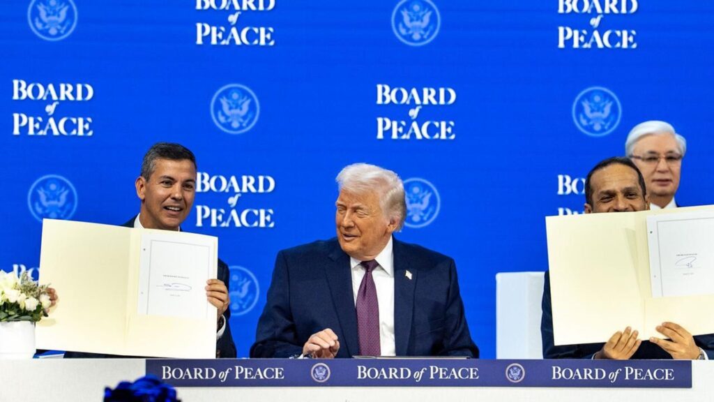 Paraguayan President Santiago Peña holding up a document at the Board of Peace in January 2026. Photo:  X/@SantiPenap.
