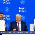 Paraguayan President Santiago Peña holding up a document at the Board of Peace in January 2026. Photo:  X/@SantiPenap.