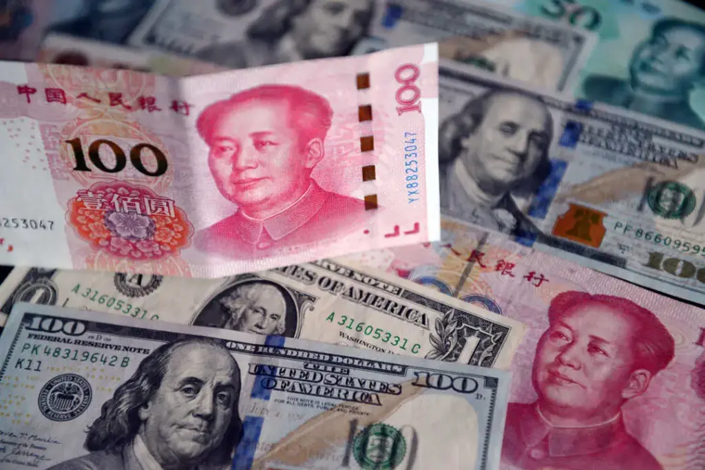 US dollar and Chinese yuan bills. Photo: Sheldon Cooper/Zuma Press.