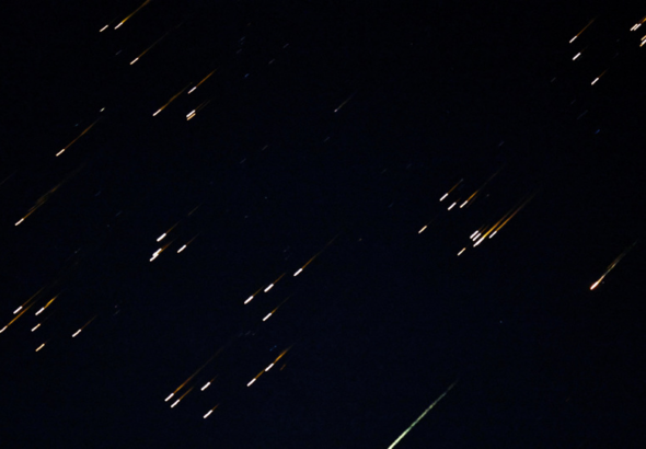 Bright fragments streak across the sky in what local media described as a missile with a split warhead, amid the U.S.-Israeli war on Iran Iran, as seen from Asqalan in occupied Palestine, March 5, 2026. Photo: Reuters.