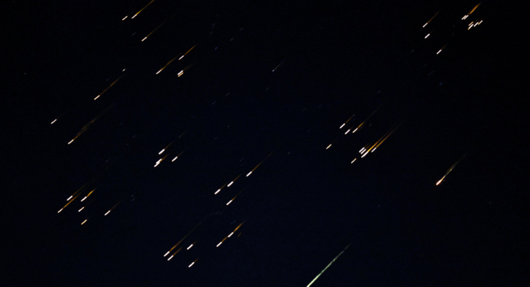 Bright fragments streak across the sky in what local media described as a missile with a split warhead, amid the U.S.-Israeli war on Iran Iran, as seen from Asqalan in occupied Palestine, March 5, 2026. Photo: Reuters.