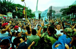 Venezuelans surrounding Miraflores Palace in Caracas during the April 2002 failed coup against President Hugo Chávez, demanding his return. File photo.