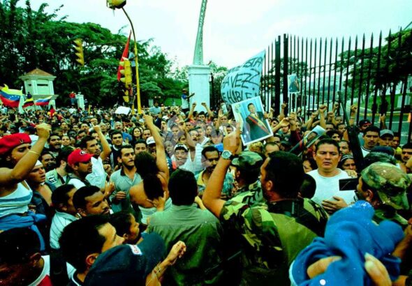 Venezuelans surrounding Miraflores Palace in Caracas during the April 2002 failed coup against President Hugo Chávez, demanding his return. File photo.