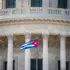 The Cuban flag flies in front of the Cuban parliament building in Havana. Photo: Prensa Latina/file photo.