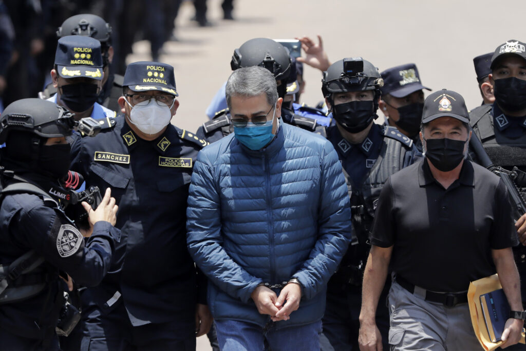 Former President of Honduras Juan Orlando Hernández is escorted by Honduran police to be extradited to the United States to face charges related to drug trafficking on April 21, 2022, in Tegucigalpa, Honduras. Photo: Jorge Cabrera/Getty Images/file photo.