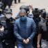 Former President of Honduras Juan Orlando Hernández is escorted by Honduran police to be extradited to the United States to face charges related to drug trafficking on April 21, 2022, in Tegucigalpa, Honduras. Photo: Jorge Cabrera/Getty Images/file photo.