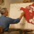 A man painting a map illustrating the "Technate of America," a proposal from the 1930s technocracy movement. Photo: LA Progressive.