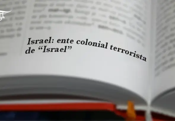 An open dictionary in which the entry Israel: colonial terrorist entity of "Israel" is highlighted. Illustration: Al-Mayadeen.