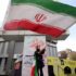 A woman waves an Iranian flag in one of the squares of Hamedan on May 23, 2026. Photo: Tasnim News Agency.