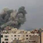 Smoke rising over the skyline of Tehran, Iran, following airstrikes conducted by the US Empire and its Zionist Entity in early March 2026. Photo: Reuters.
