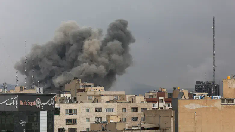 Smoke rising over the skyline of Tehran, Iran, following airstrikes conducted by the US Empire and its Zionist Entity in early March 2026. Photo: Reuters.