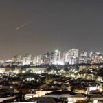 A streak of light illuminates the sky during a missile attack from Iran towards the Israeli-occupied territories as seen from Asqalan, June 7, 2026. Photo: Reuters.