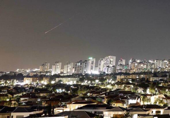 A streak of light illuminates the sky during a missile attack from Iran towards the Israeli-occupied territories as seen from Asqalan, June 7, 2026. Photo: Reuters.