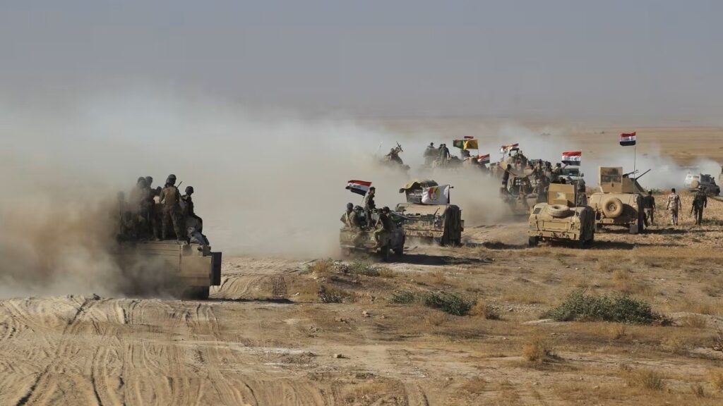 Iraqi forces backed by the Hashed Al-Shaabi (Popular Mobilization units) advance towards the town of Tal Afar, west of Mosul, August 22, 2017. Photo: Ahmad Al-Rubaye/AFP/file photo.