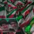 Iranian demonstrator wave Iranian flags and protrait of Iran's Leader Sayyed Mojtaba Khamenei, right, and his late father Sayyed Ali Khamenei in a gathering at a square in Tehran, Iran, May 29, 2026. Photo: AP.