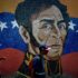 People walk past a mosaic mural of Simón Bolívar, the Liberator of South America, in Caracas. Photo: Matias Delacroix/AP/file photo.