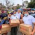 GEM members in La Guaira, Venezuela, holding boxes of humanitarian aid. Photo: Funds Society.