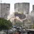 Heavily damaged building in La Guaira state, Venezuela, being demolished on Thursday, July 30. Photo: Juan Barreto/AFP.