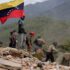 Rescuers search for victims within the rubble of a collapsed building in Carabellada, La Guaira, after the double earthquake in Venezuela on June 24. Photo: Jesús Vargas/Getty Images.