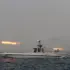 An Iranian military boat firing a rocket during a naval war game. Photo: Ali Mohammadi/AP.