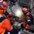 Members of an El Salvador rescue team are helping to search collapsed buildings in La Guaira. Photo: Reuters.