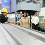 Acting President Delcy Rodríguez shakes hands with a worker at a factory visit. Photo: Venezuelan Presidential Press.