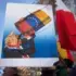 A protester holds a sign with a caricature of Donald Trump drinking Venezuelan oil. Photo: David Canales/Zuma Press/ContactoPhoto.