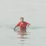 A Moroccan child reaches the coast of Ceuta. Photo: YouTube.