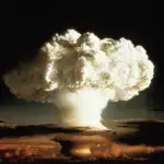 The image shows a nuclear explosion in the shape of a mushroom cloud, with a large plume of smoke and fire rising over a dark landscape. Photo: Mattias Forsgren/file photo.