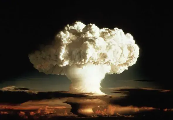 The image shows a nuclear explosion in the shape of a mushroom cloud, with a large plume of smoke and fire rising over a dark landscape. Photo: Mattias Forsgren/file photo.