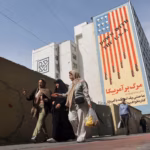 Anti-U.S. mural on a building in Tehran, Iran, says ‘Down with the USA’. Photo: Majid Asgaripour/Reuters.
