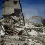 A Zionist bulldozer demolishing a house in Rafah, Gaza, a scene consistent with broader efforts to cover up their war crimes. Photo: +972 Magazine.
