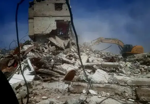 A Zionist bulldozer demolishing a house in Rafah, Gaza, a scene consistent with broader efforts to cover up their war crimes. Photo: +972 Magazine.