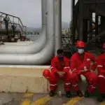 Venezuelan oil workers. Photo: Ernesto Vargas/AP Photo.