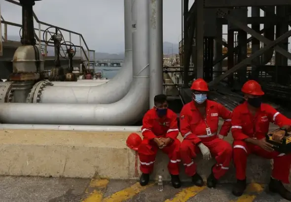 Venezuelan oil workers. Photo: Ernesto Vargas/AP Photo.