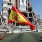 A Spanish flag is raised in Gaza. Photo: Abdelhakim Abu Riash/Al Jazeera.