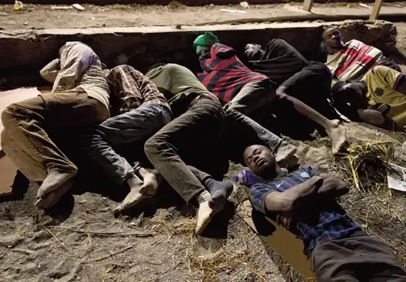 Migrants who crossed into Spain from Morocco sleep on a Ceuta beach, August 3 2026. Photo: Morning Star.