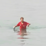A Moroccan child reaches the coast of Ceuta. Photo: YouTube.