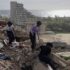 Emergency responders trying to recover casualties in a collapsed building in Catia La Mar, La Guaira state, Venezuela. Photo: ANSA/EPA.