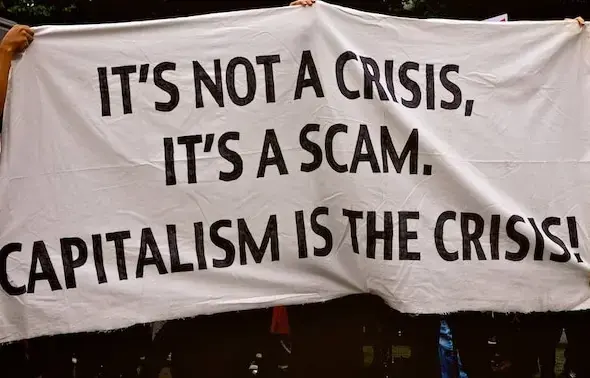 Capitalism IS the Crisis May 25, 2013 March from Union Square to Washington Square New York, NY. Photo: Ed/Flickr.