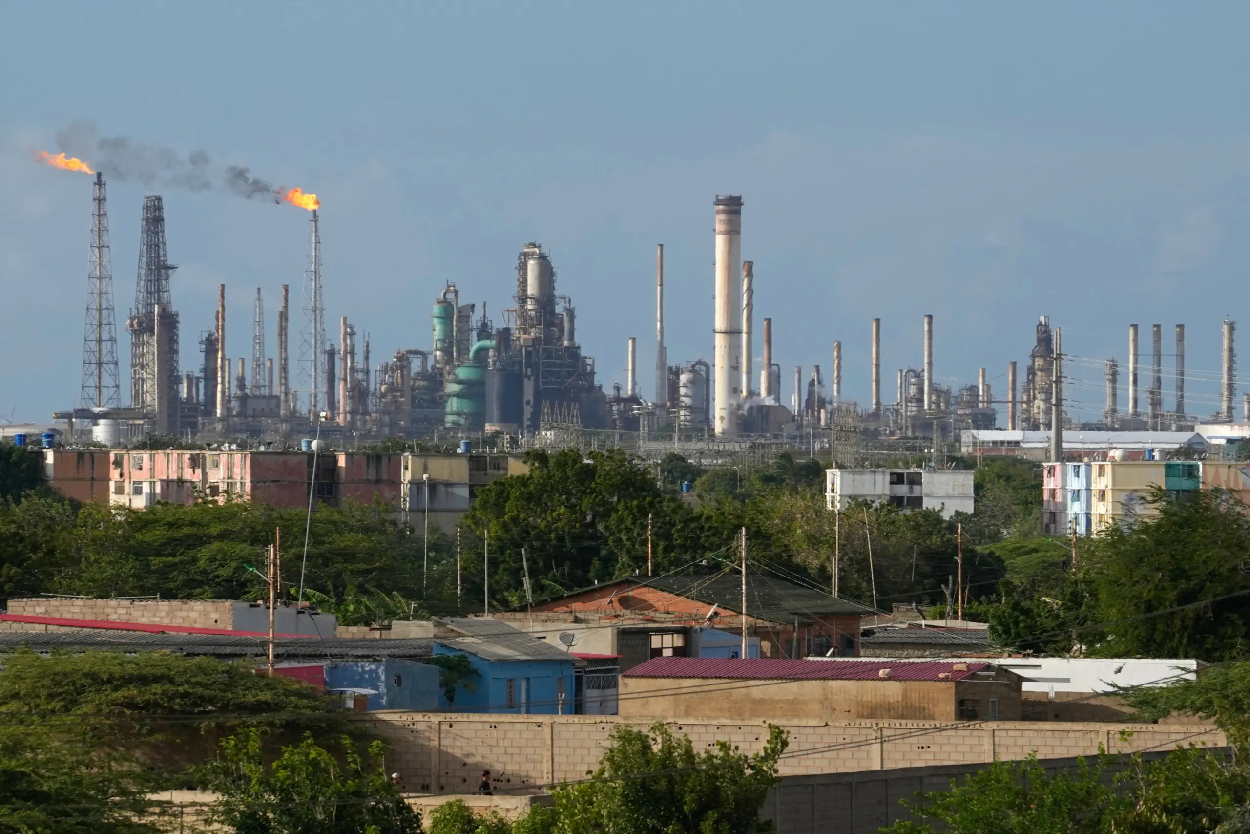 Flames rise from flare stacks at the Amuay refinery in Los Taques, Venezuela, Jan. 14, 2026. Photo: Matias Delacroix/AP Photo.