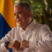 Colombia's President Iván Duque speaking to the camera, with his nation's flag in the background. Photo: Últimas Noticias 